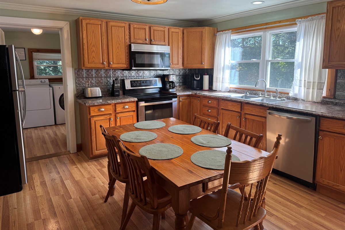 Kitchen with laundry room beyond
