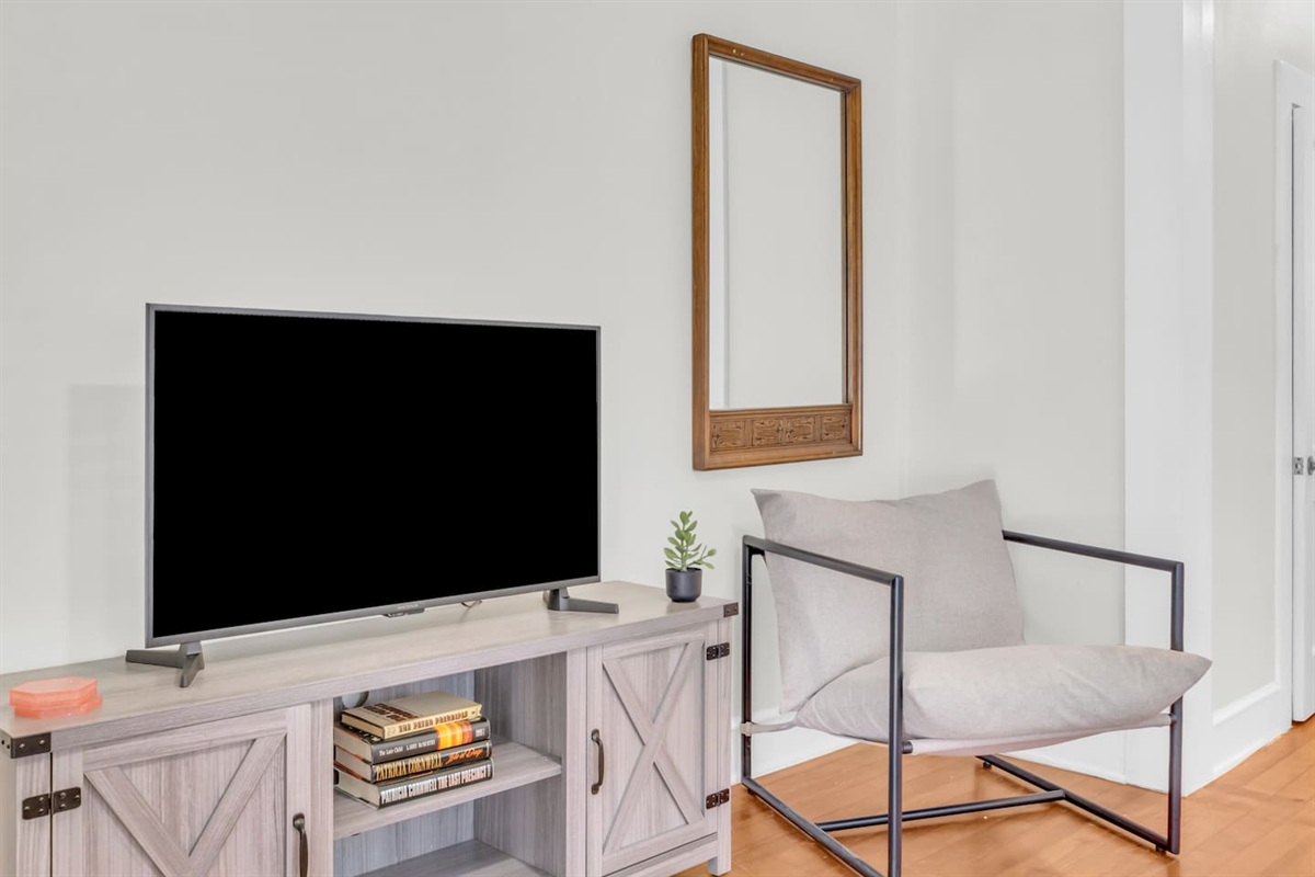 Living area with TV and open layout.