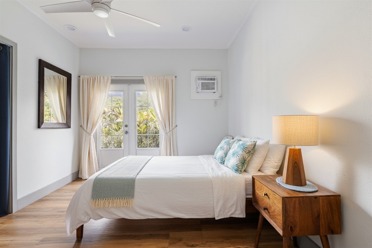 Queen Bed | Representative Interior. Finishes & Decor Vary By Unit