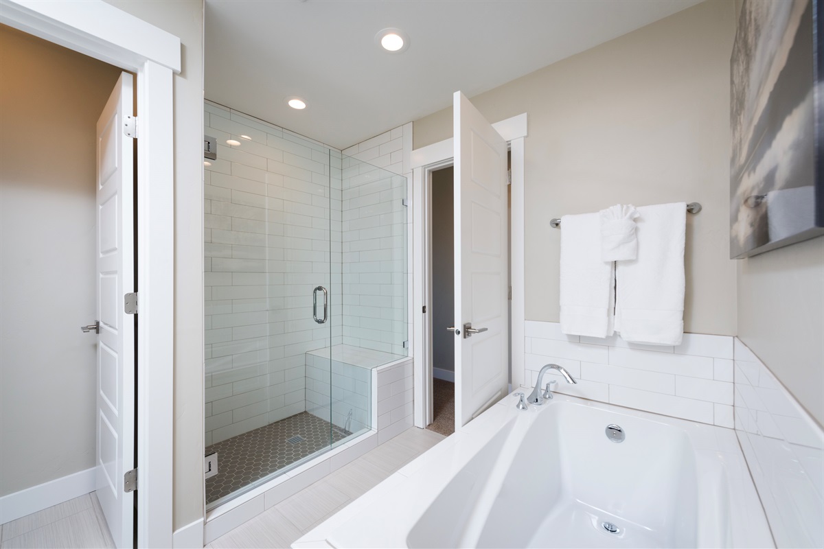 Indulge in a soaking tub and glass shower after a day on the slopes