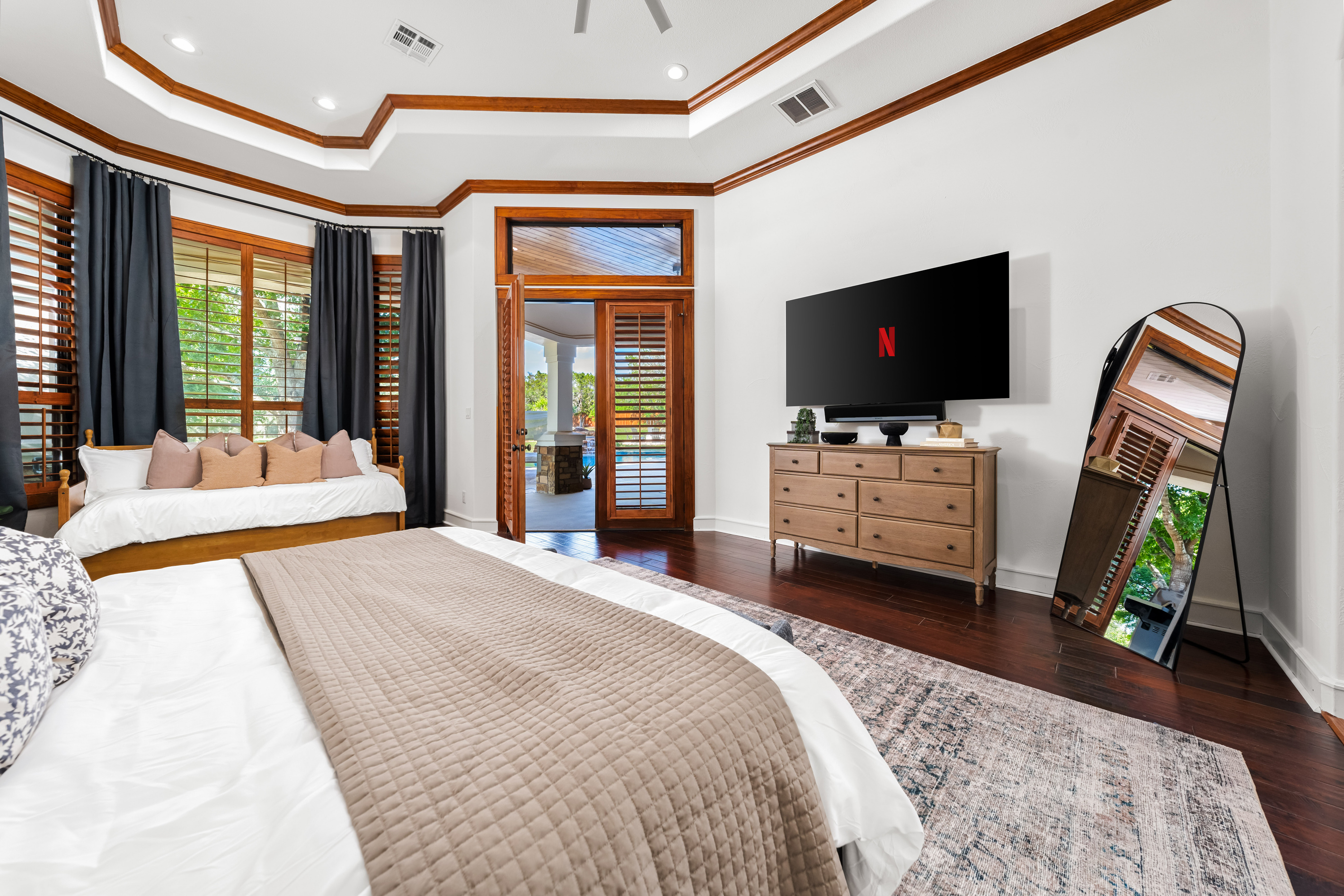 Enjoy a luxurious night’s rest in this inviting bedroom.