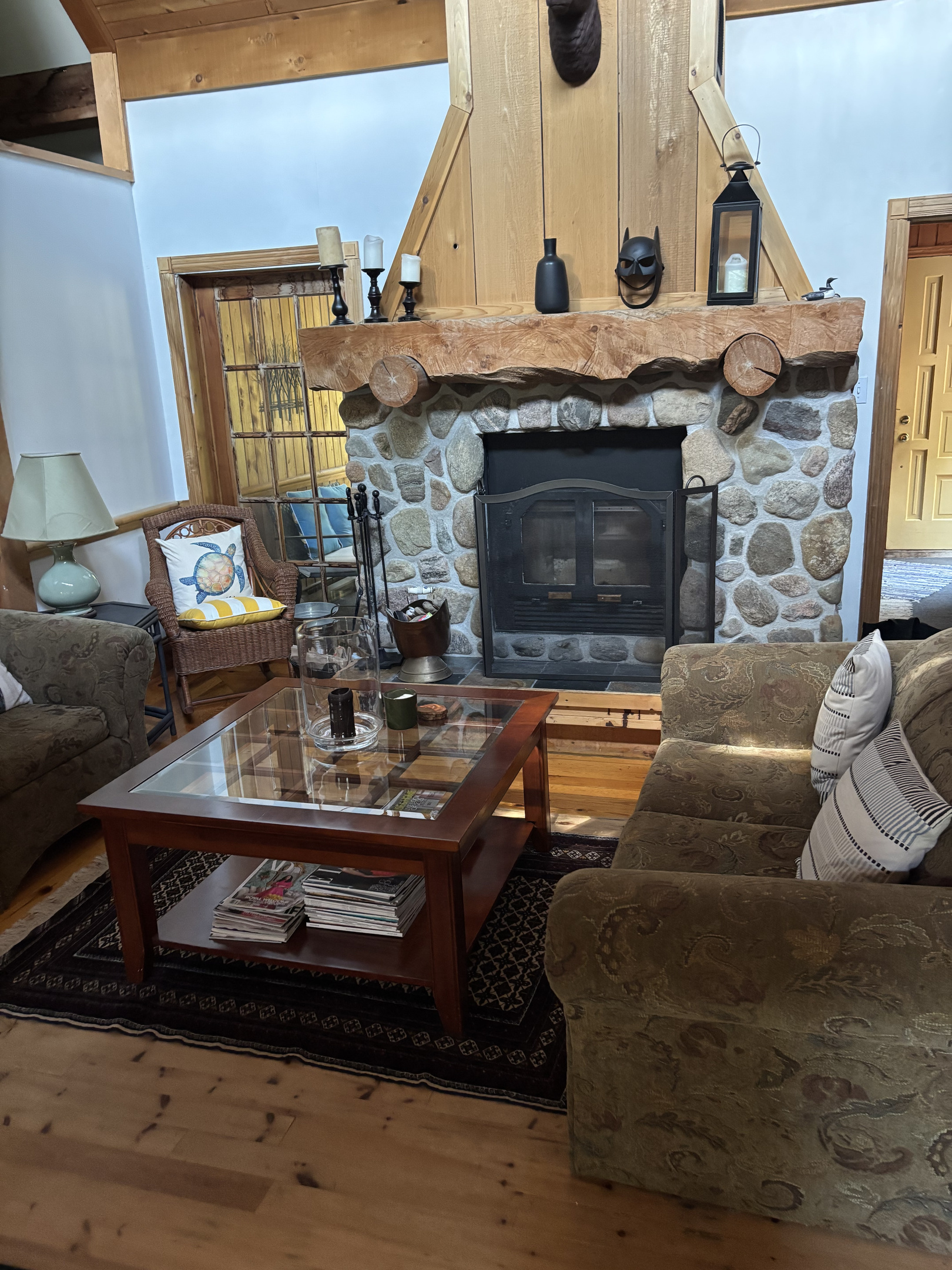 Cottage central seating area with fireplace and wood-burning insert