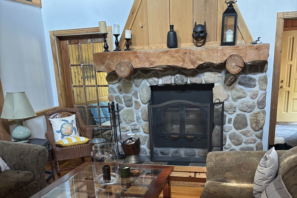 Cottage central seating area with fireplace and wood-burning insert