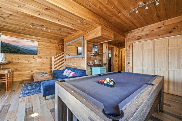 All the fun in one area!  Convertible pool table can also be used for ping pong or even for eating bigger meals with the long benches as seats.  
