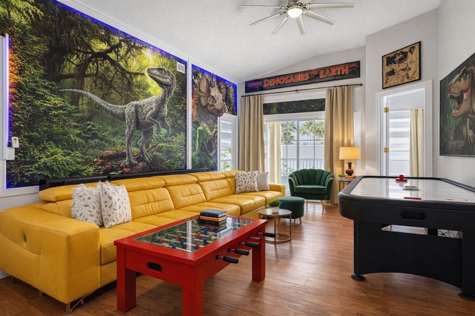 Family-friendly living  room with dinosaur-themed wall art and vibrant seating.