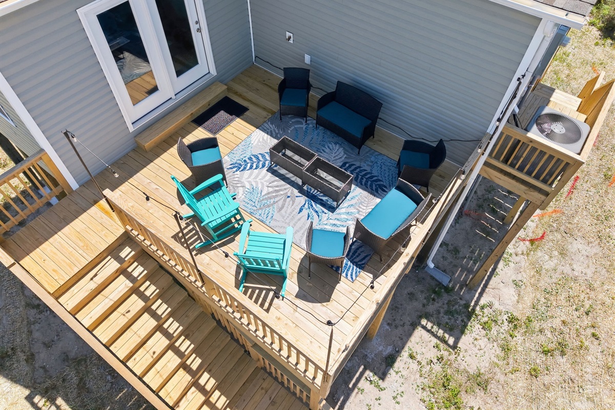 Large outdoor deck with seating area&mdash;perfect for groups, gathering, and making memories