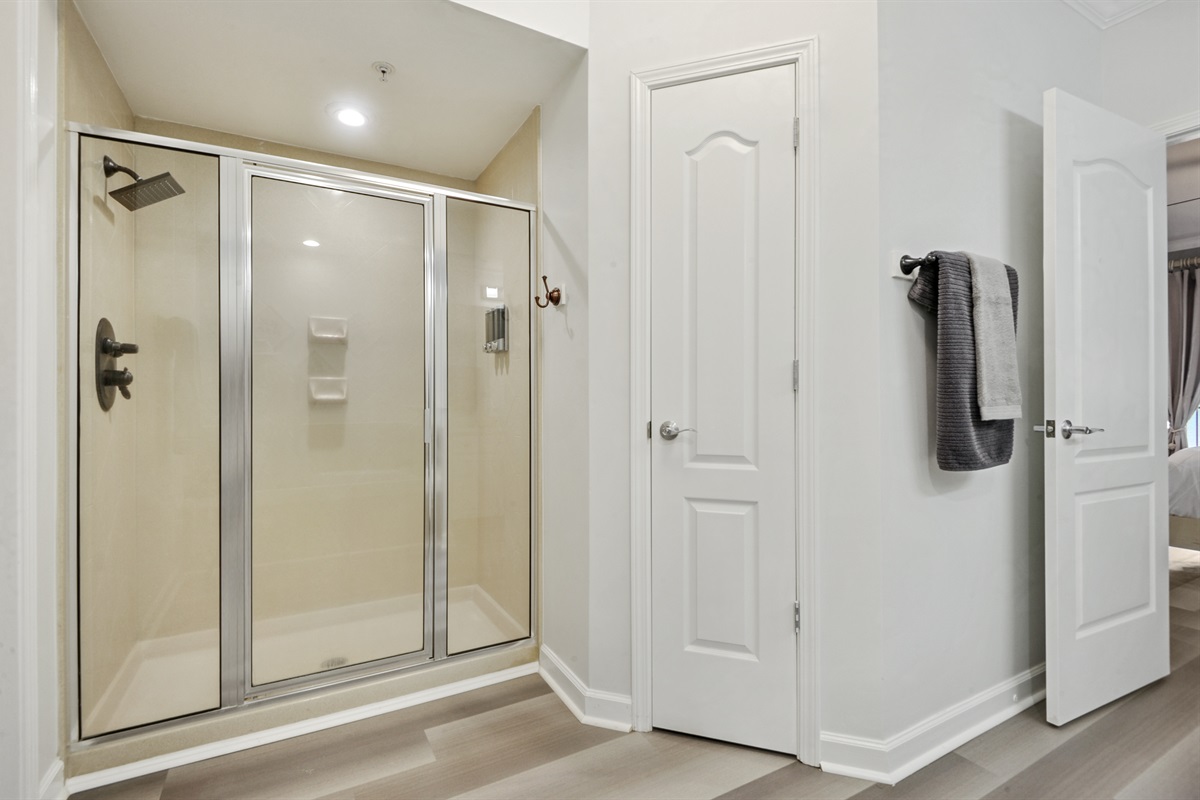 Master bath with dual vanity, shower, tub, toilet closet.