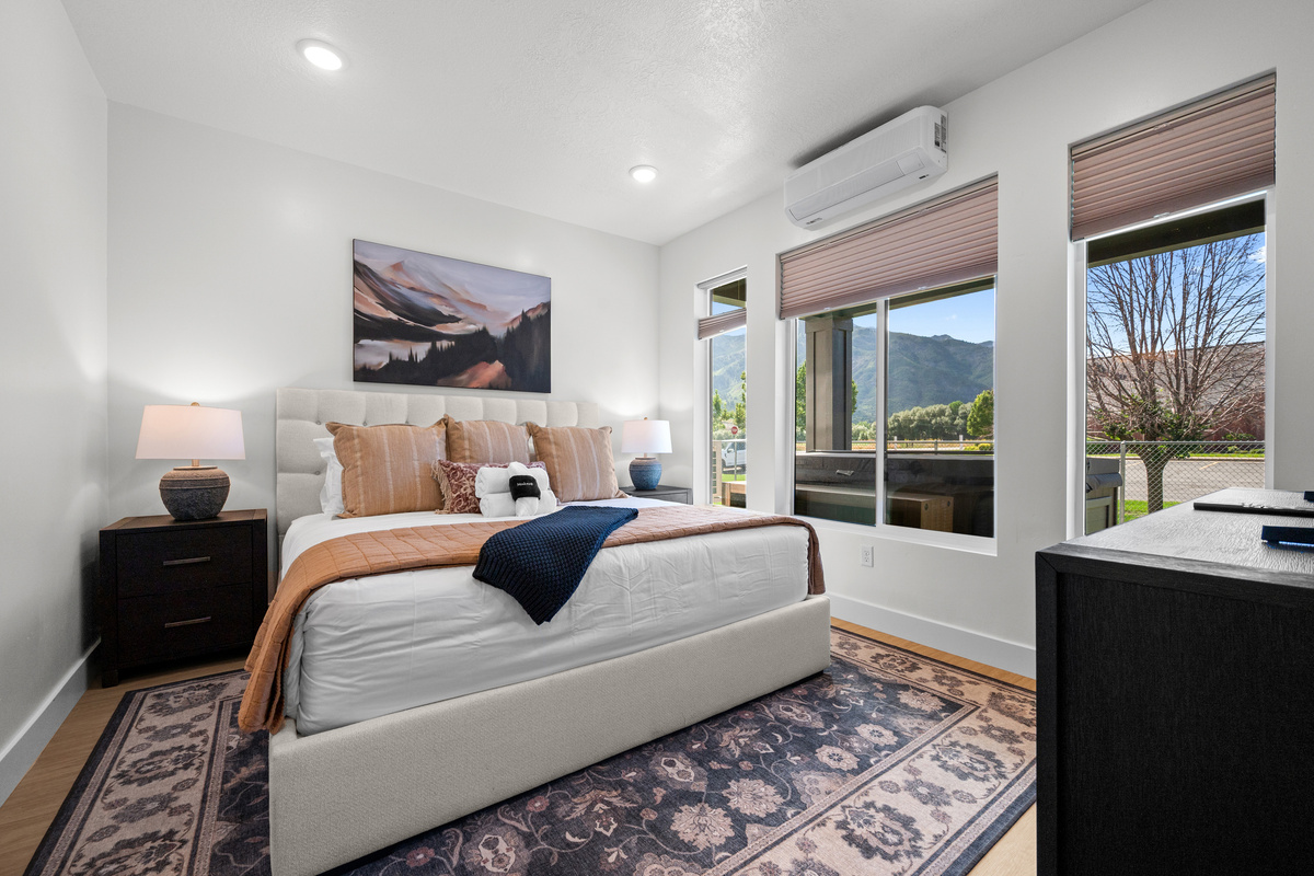 A peaceful bedroom retreat with soft natural light and comfortable furnishings for a restful night’s sleep.