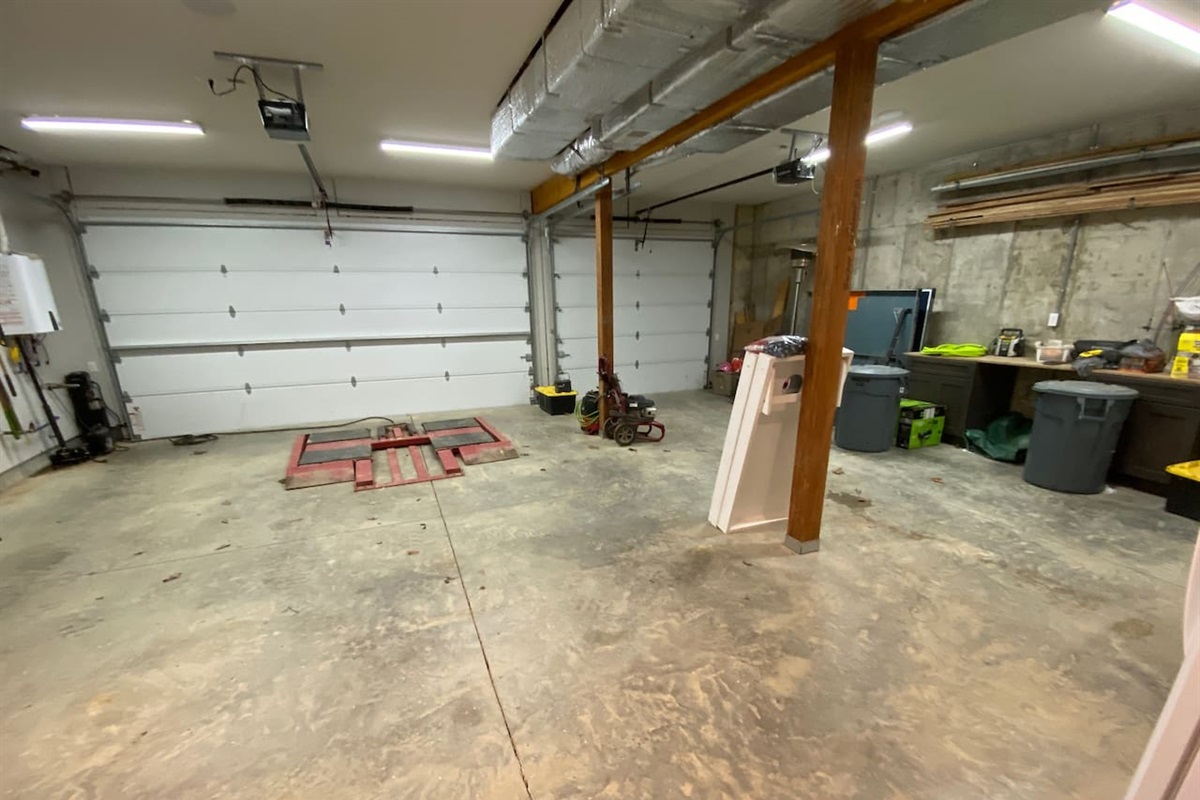 Large 3 car garage to store rzrs while visiting. Please note the pressure washer in the pic for your use to clean your rzr and the rzr lift to fix your rzr if you happen to break it while riding the trails.