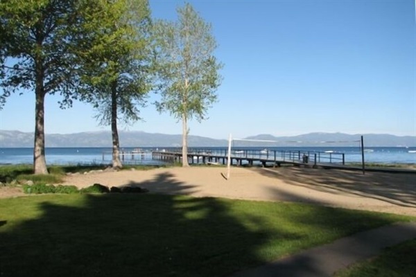 View of sand volleyball court, dock and Lake Tahoe from the living room