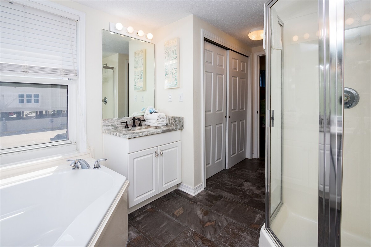 Primary Bathroom with 2 vanities, soaker tub and stand up shower