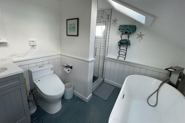 Upstairs full bathroom with separate shower and tub, plus heated toilet/bidet