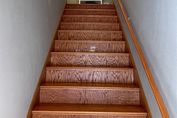 stairs to second level    *note bedroom is on the main lower entry level must take stairs to access upper loft kitchen living bathroom* 
