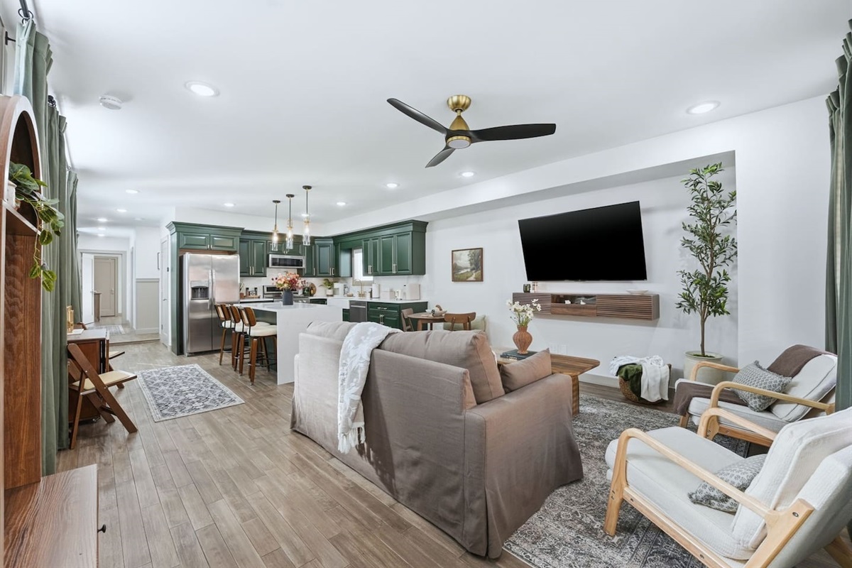 Spacious living area that flows into the kitchen and dining space, creating a welcoming place to gather, watch TV, or spend time together.