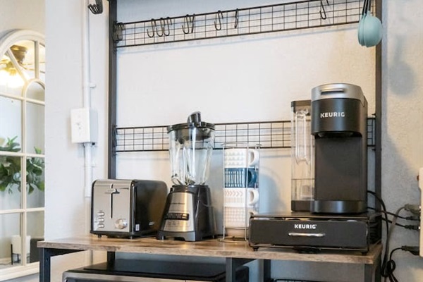 Cozy coffee nook equipped with multiple appliances, perfect for brewing your favorite beverages and starting the day off right.