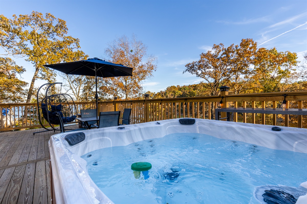 Relax in your private hot tub overlooking the lake—perfect for a romantic getaway.