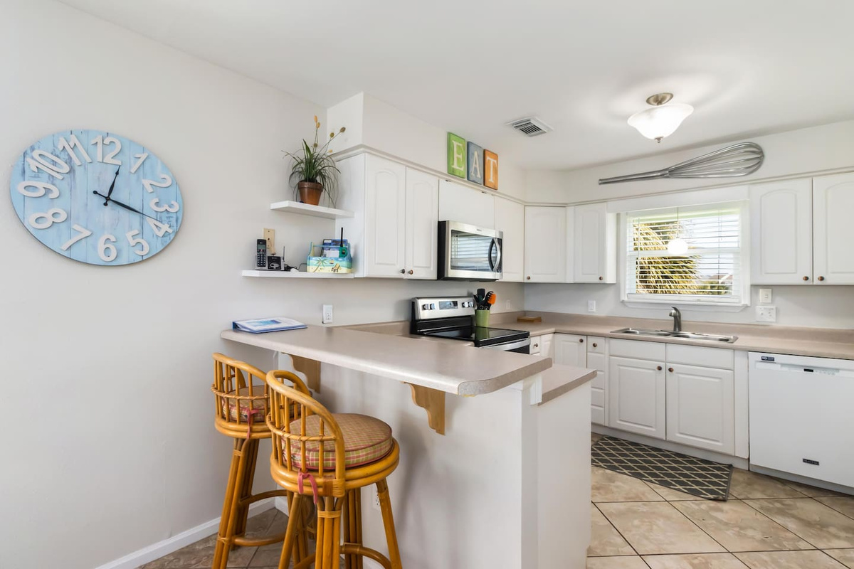 Cook breakfast while two guests perch at the kitchen bar &mdash; the morning routine runs better when everyone's in the same room.
