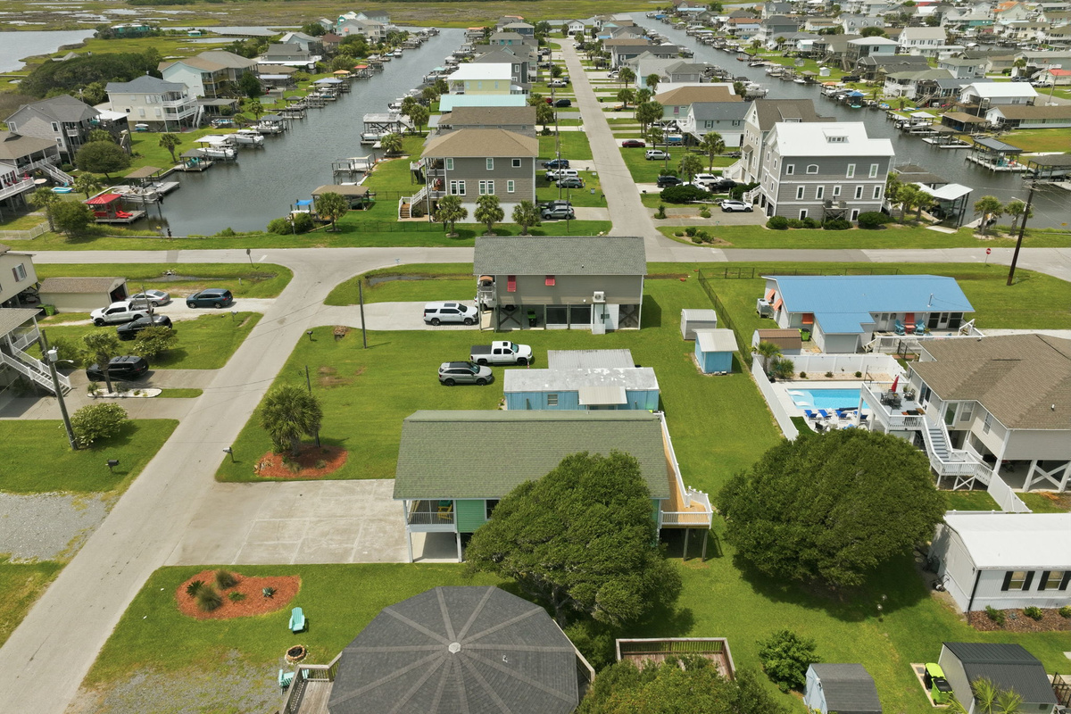 Aerial view showcasing the peaceful canal neighborhood, nearby marinas, and convenient location between the Intracoastal Waterway and the Atlantic Ocean