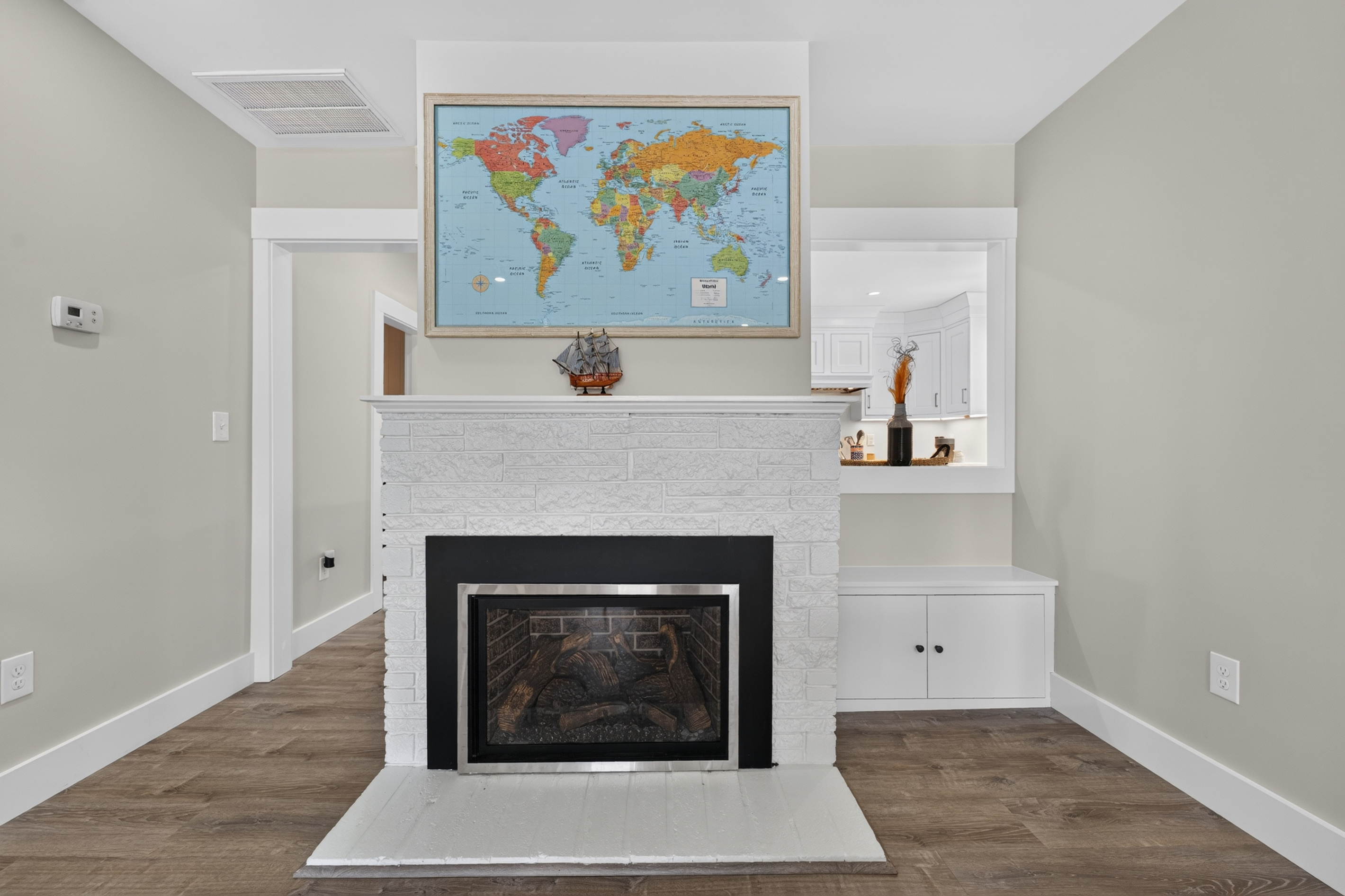 Elegant fireplace with built-in shelving, creating a warm and inviting atmosphere for relaxing evenings.