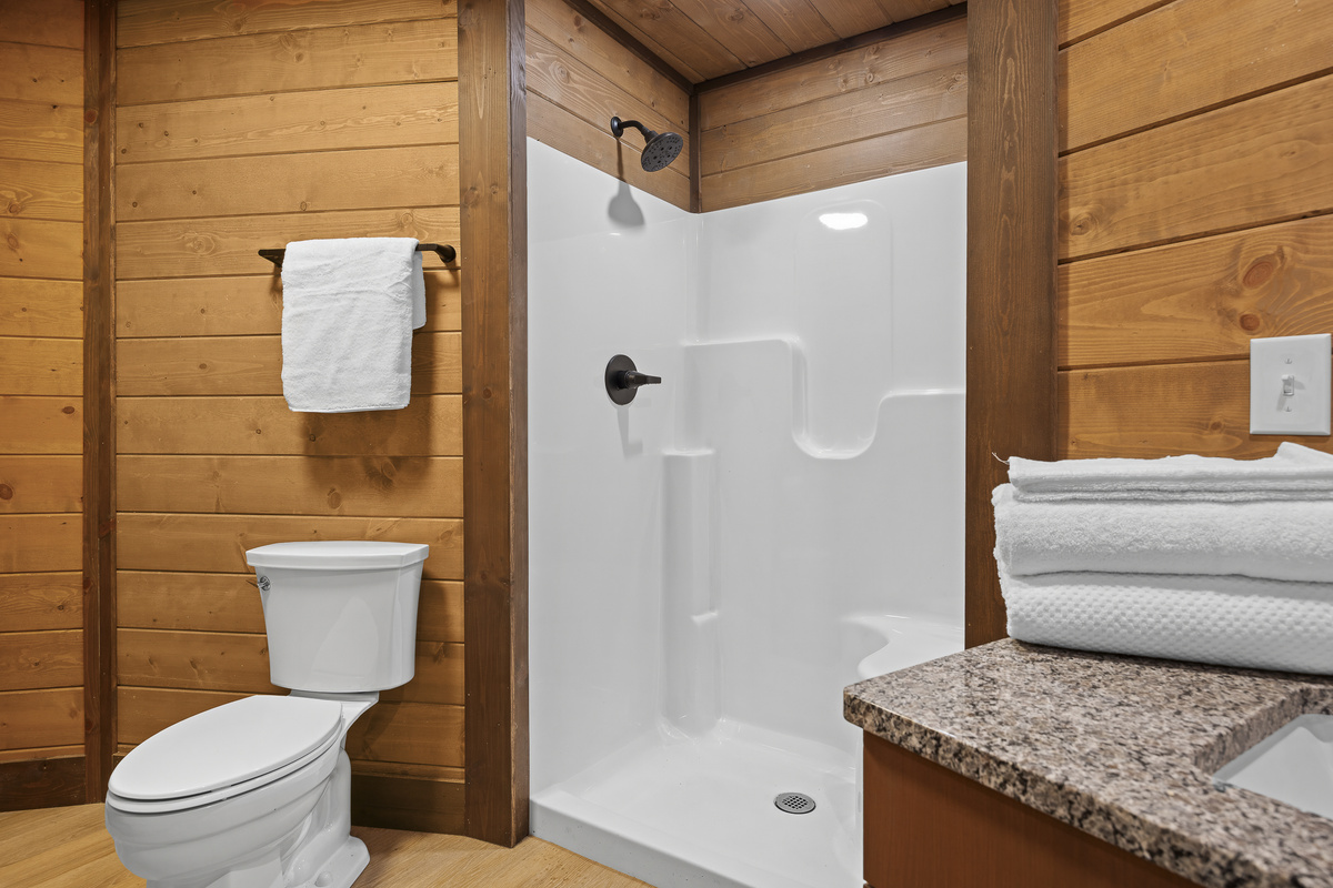 Bathroom Retreat: Refresh in style with modern fixtures and natural wood accents!