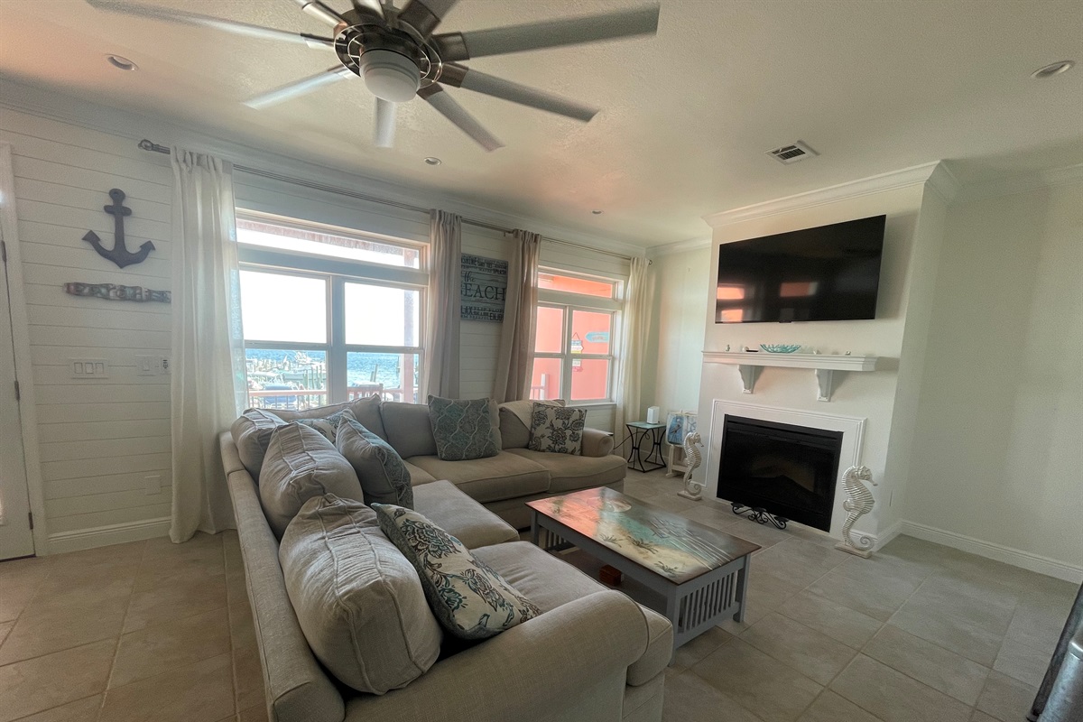 Living room with smart tv plus access to balcony