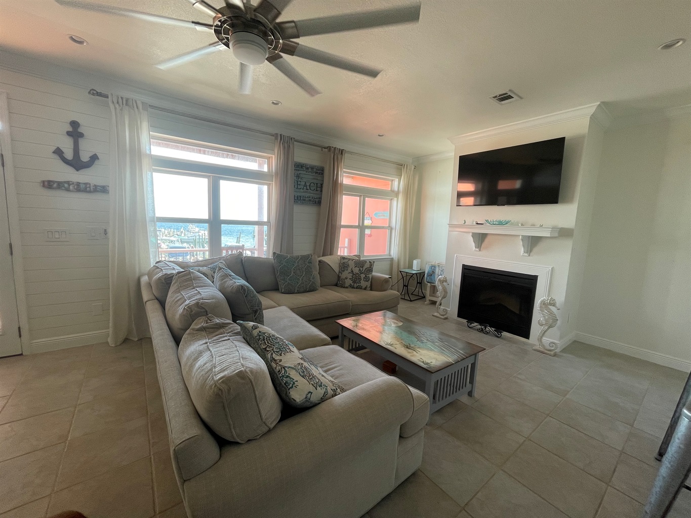 Living room with smart tv plus access to balcony