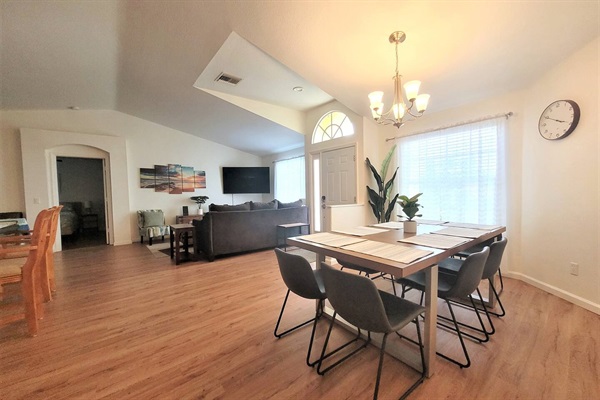 Dining table fits up to 8 people with 2 chairs on each side of the table.  2 additional seating spots at the kitchen island.