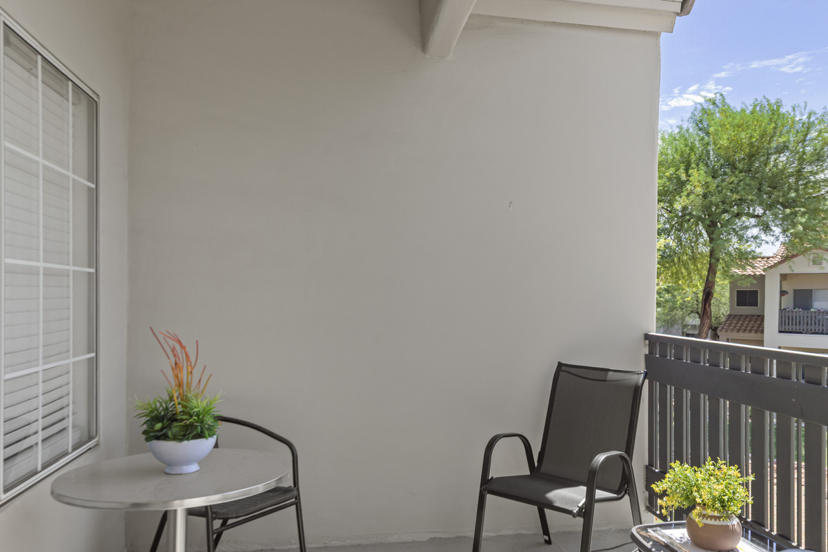 Relax outdoors with comfortable balcony seating—a great spot for morning coffee or unwinding after exploring the area.