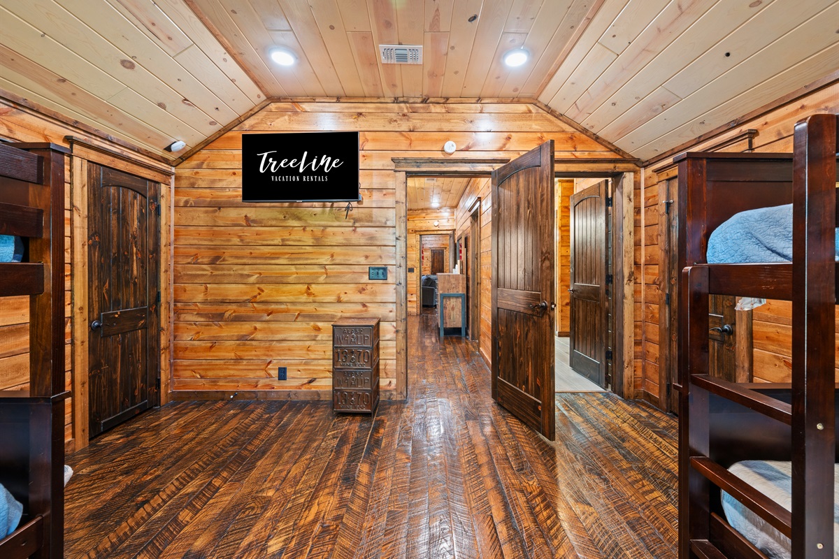 This connecting hallway maintains the home’s welcoming feel, offering easy access between rooms while keeping everything conveniently laid out.