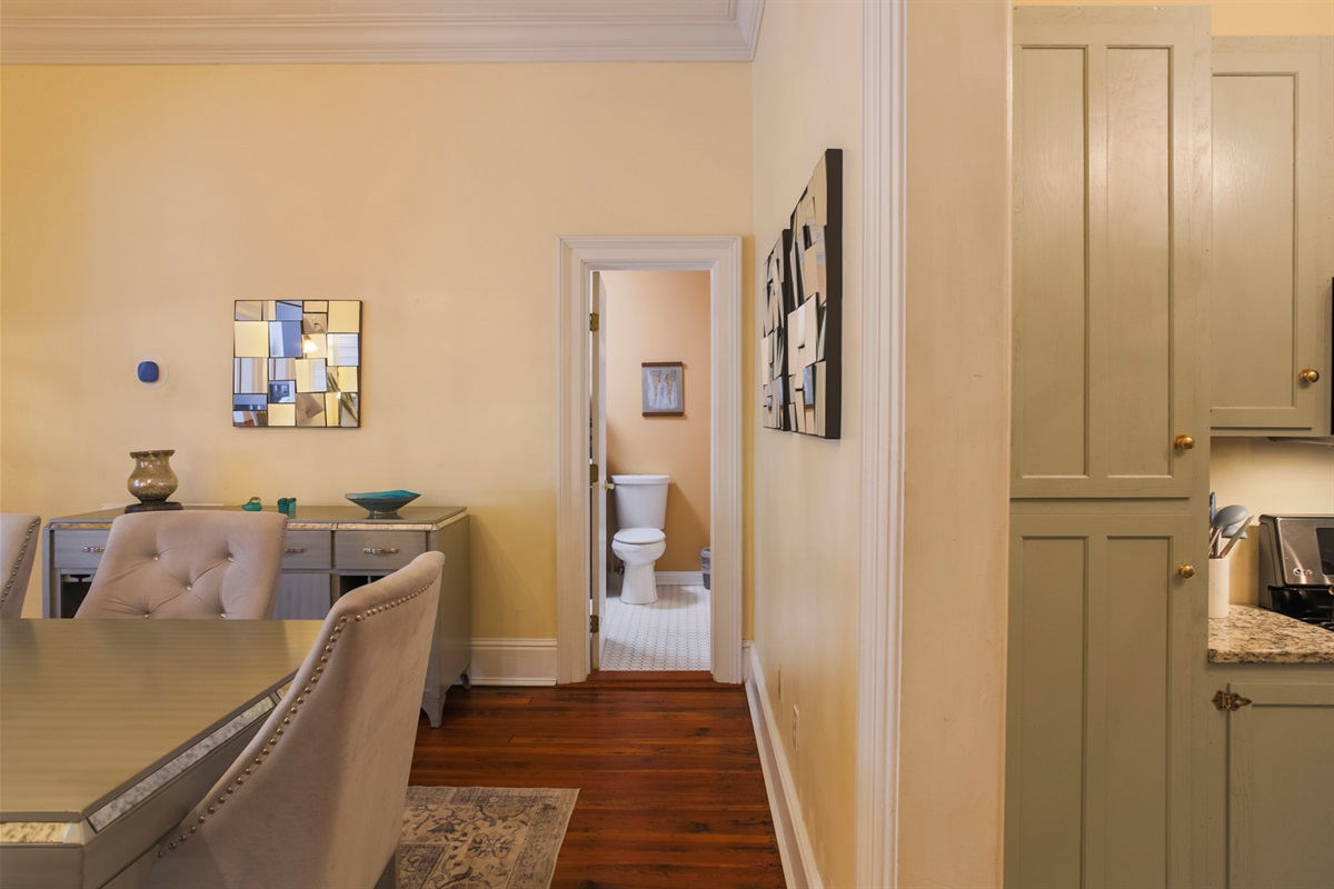 This ensuite bath links the king bedroom and dining room, offering convenient access from both spaces.