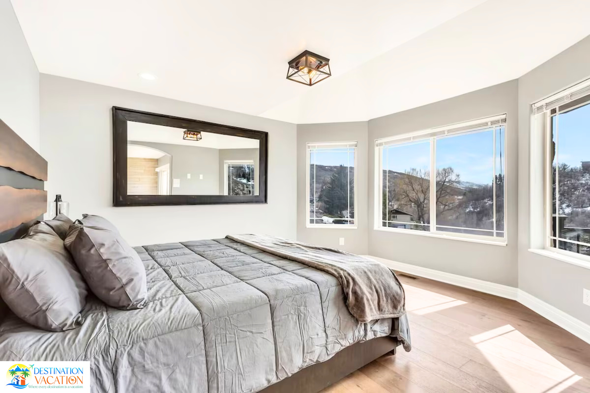 Sunlit bedroom creates a tranquil mountain escape.