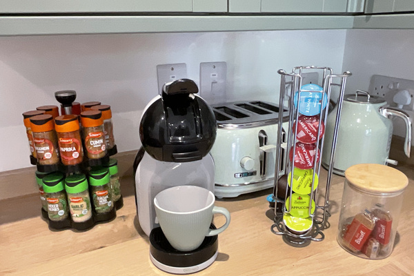Complementary coffee, biscuits, spice rack.