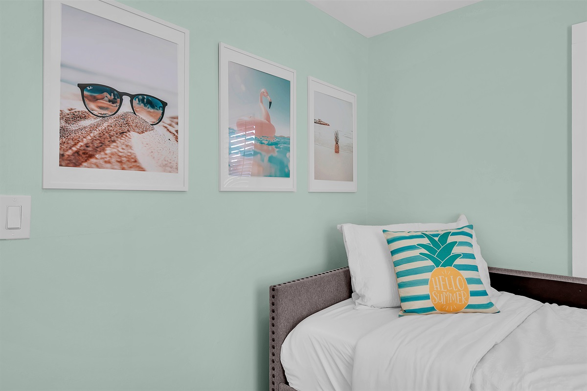 Playful beach-themed artwork and summer vibes define this cozy Ocean Grove bedroom corner. Minutes from Asbury Park's famous boardwalk and beach activities.