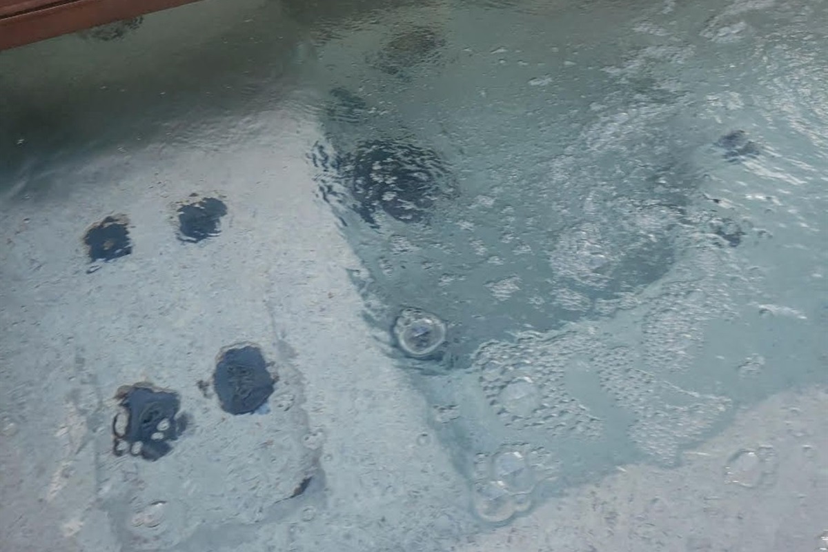 Relax in the hot tub with privacy and peaceful creekside surroundings