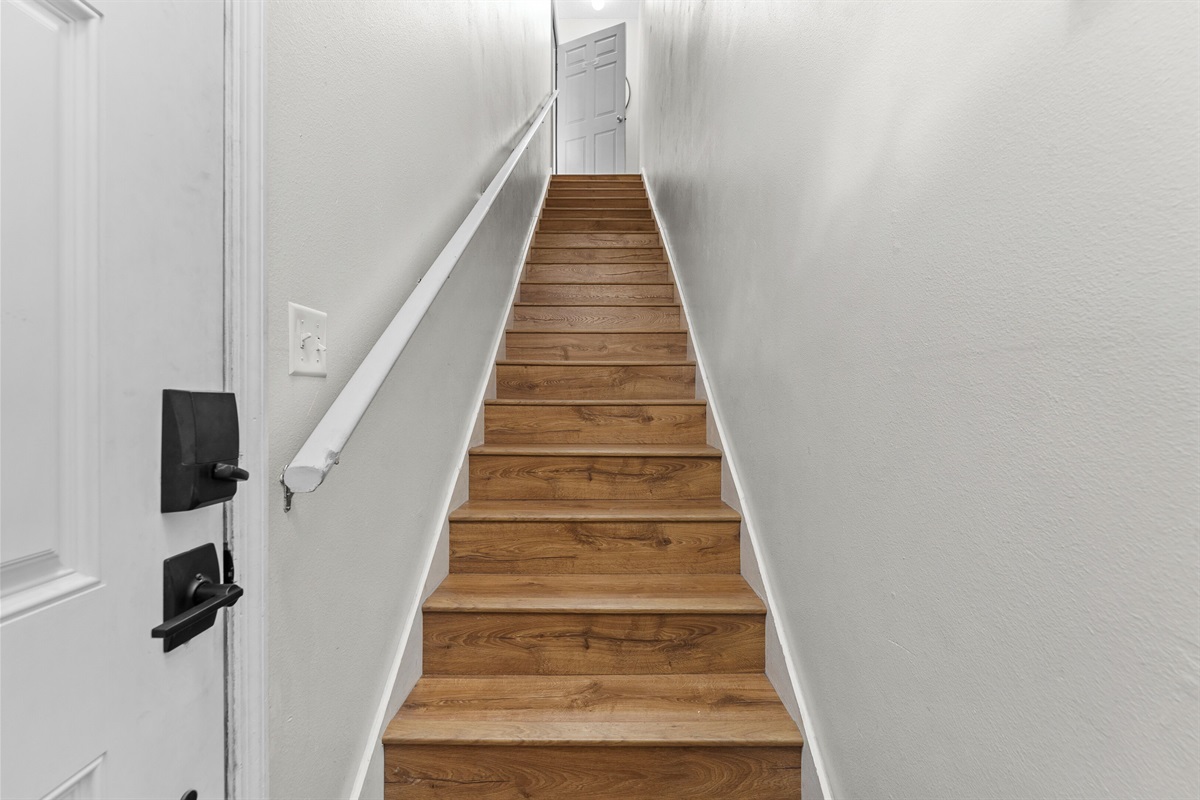 As you enter there is a set of stairs leading up to the main floor.