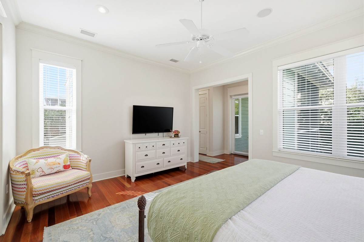 Wake up to natural light in this spacious bedroom, offering plenty of room to stretch out and relax.