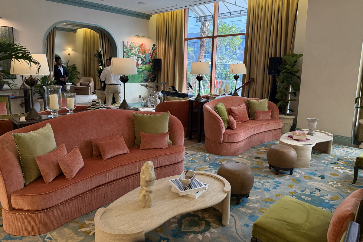 Sink into the lobby lounge - sculptural coral sofas and warm lighting made for slow evenings.