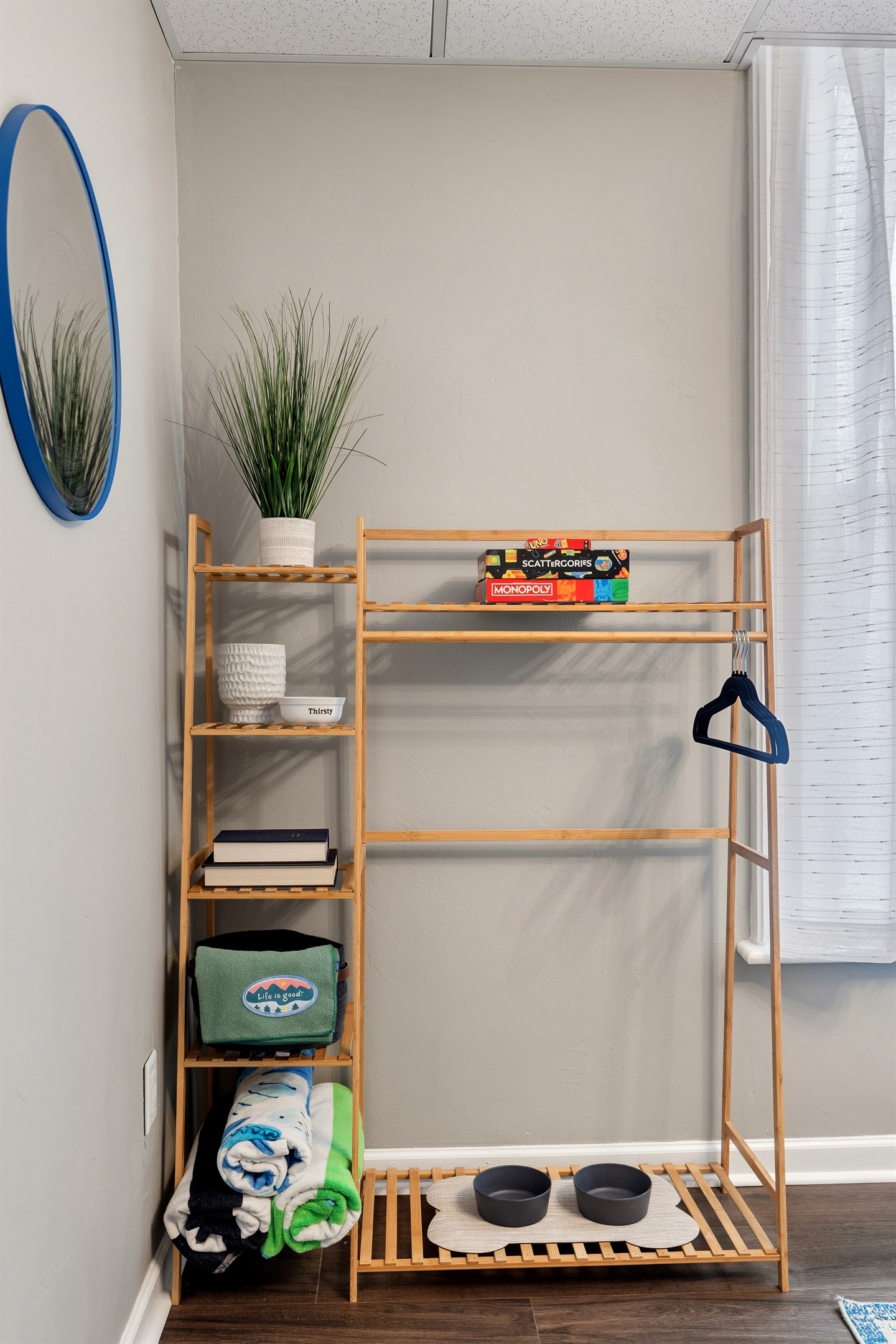 Dining area with storage shelf, board games, and beach gear available for guests