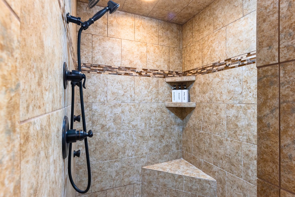 Walk-in shower with tile finishes for a spa-like feel.