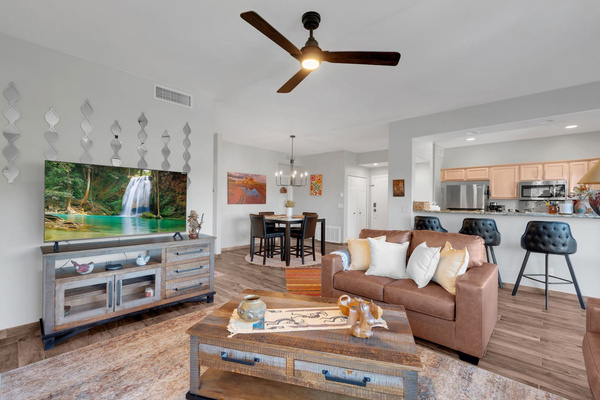 Spacious living room with leather sofas, smart-TV, coffee table