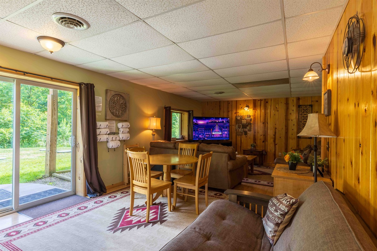 The futon to the right is on the lower level, right beside the bedroom.