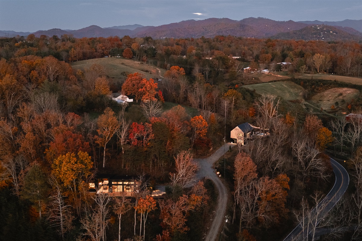 {Estate Aerial} A mountain estate carved into the forest—two luxury homes, sweeping sunset views, and absolute privacy on 3+ acres just outside Asheville.