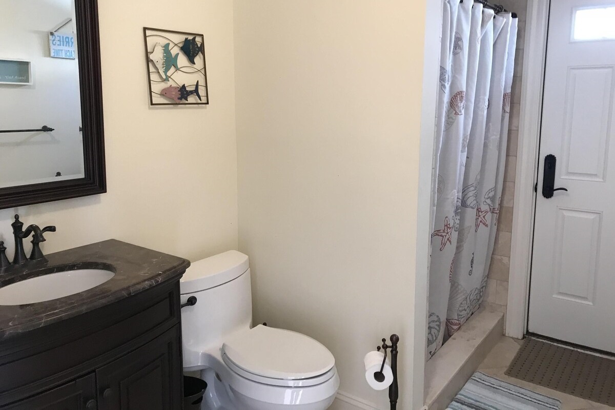Full bath on ground level.  Can be accessed from exterior of property or garage