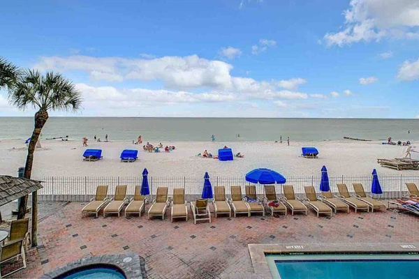 View of the beach and pool loungers