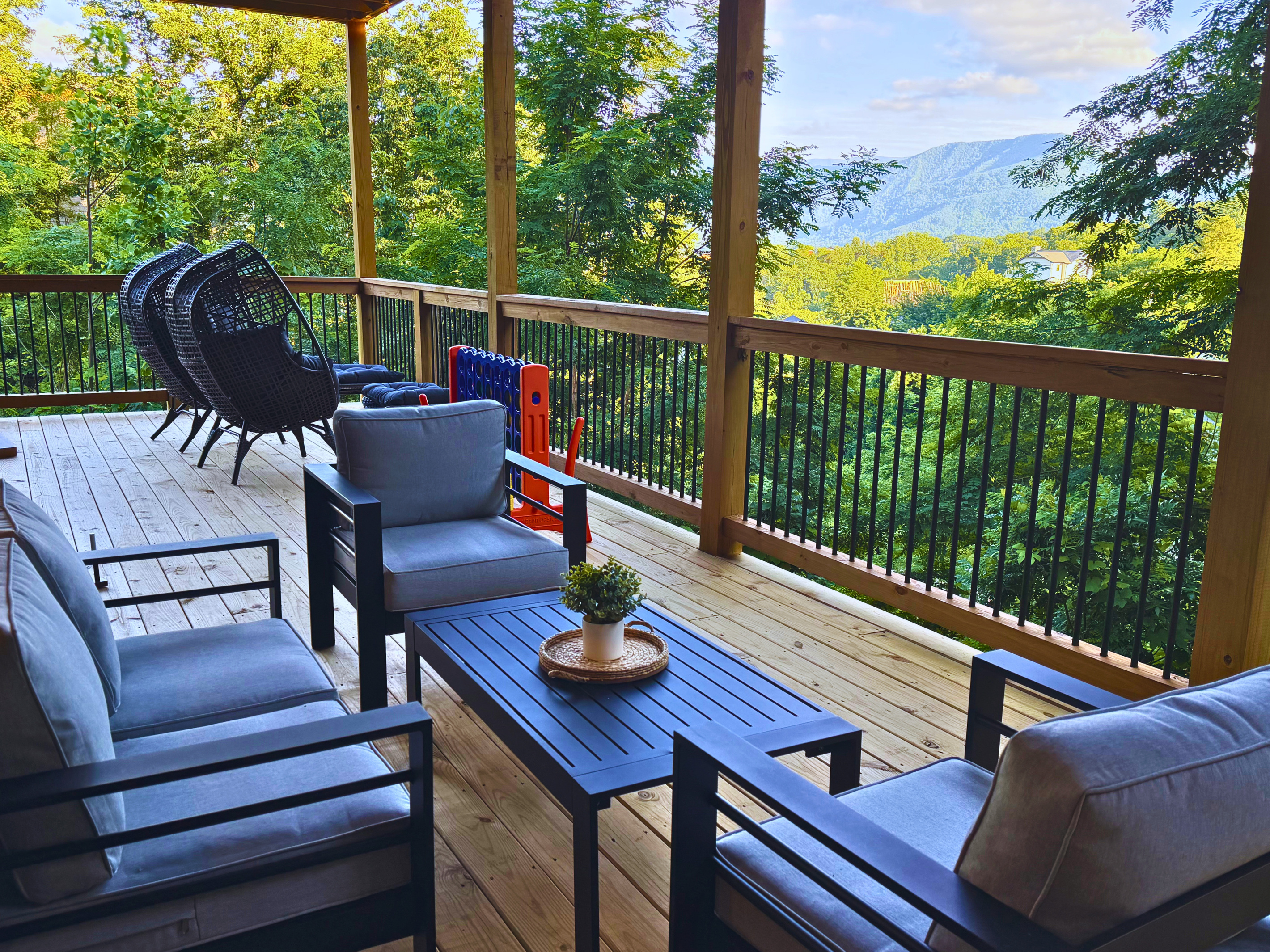 Your front-row seat to the Smokies. Unwind on the spacious covered lower deck with comfortable seating, mountain views, and plenty of room to enjoy your morning coffee or evening conversation.