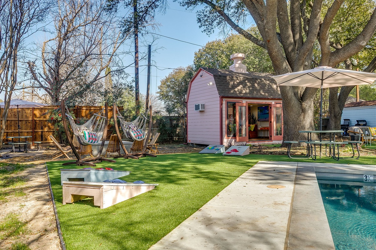 Private backyard with sport pool, turf and cornhole