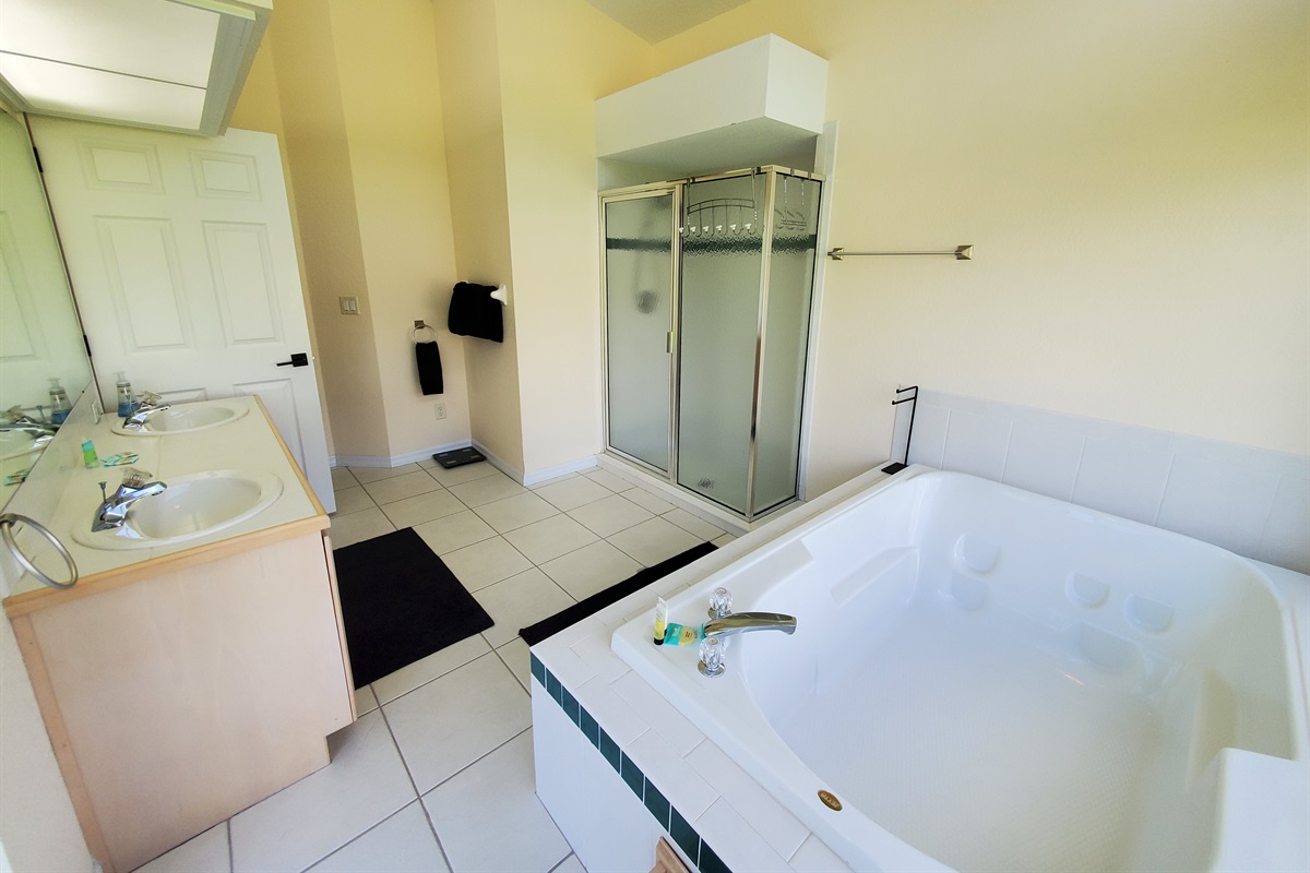 2nd King private bathroom with 2 sinks, sunk in tub and walk in shower