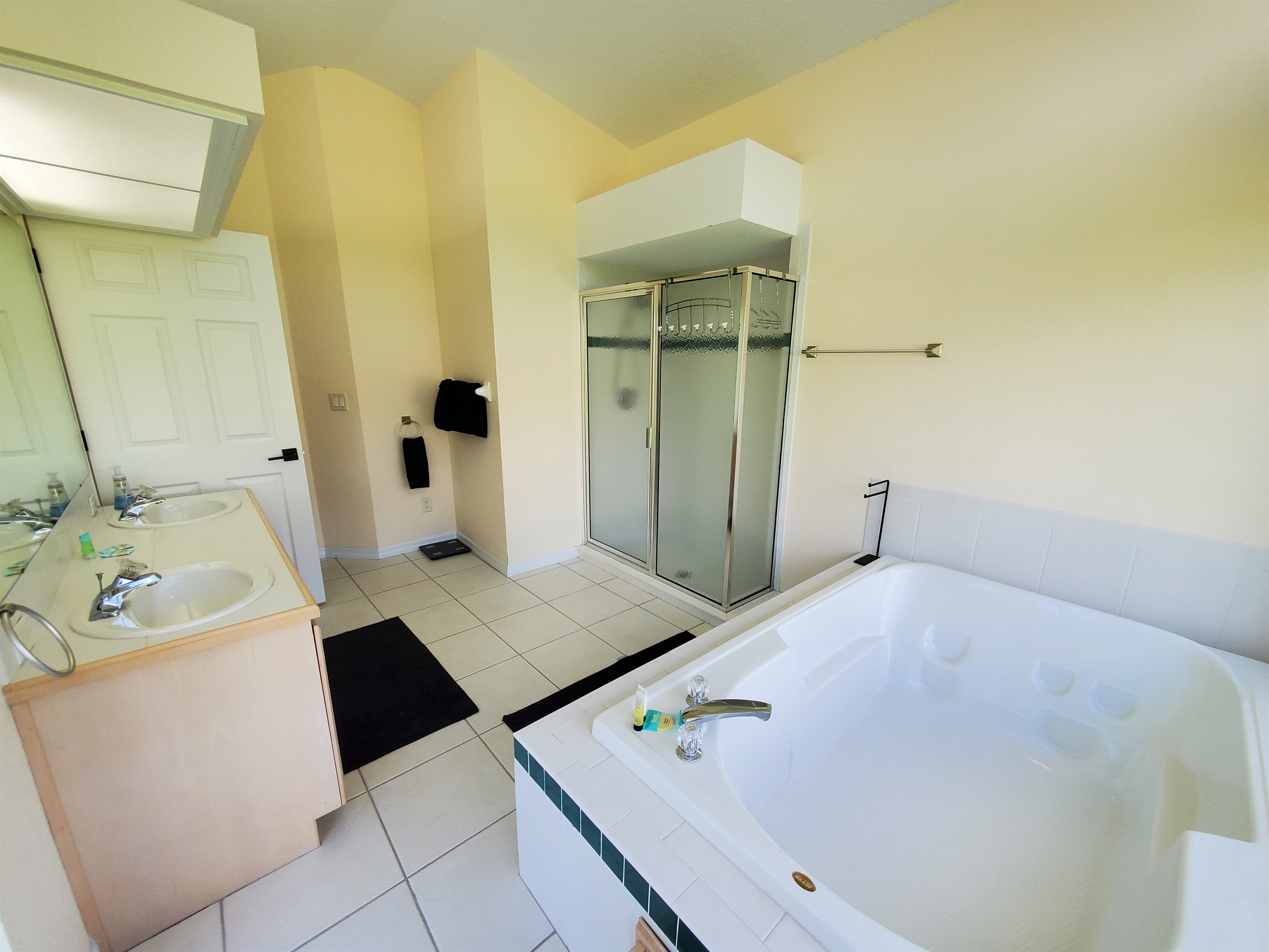 2nd King private bathroom with 2 sinks, sunk in tub and walk in shower