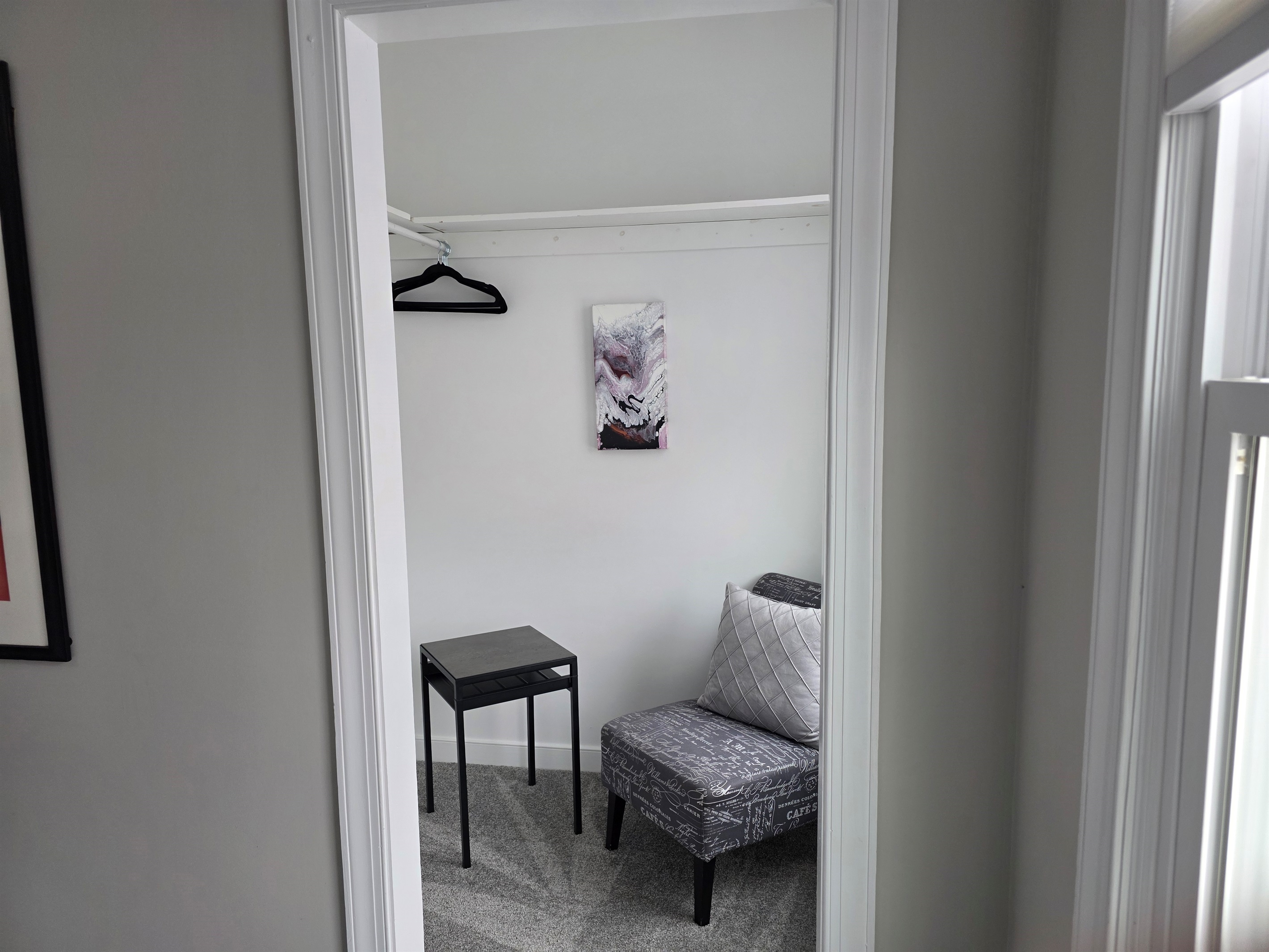 Cozy Reading Nook & Dressing Area in Bedroom 3: Functional dressing corner with a stylish accent chair and extra hanging space.