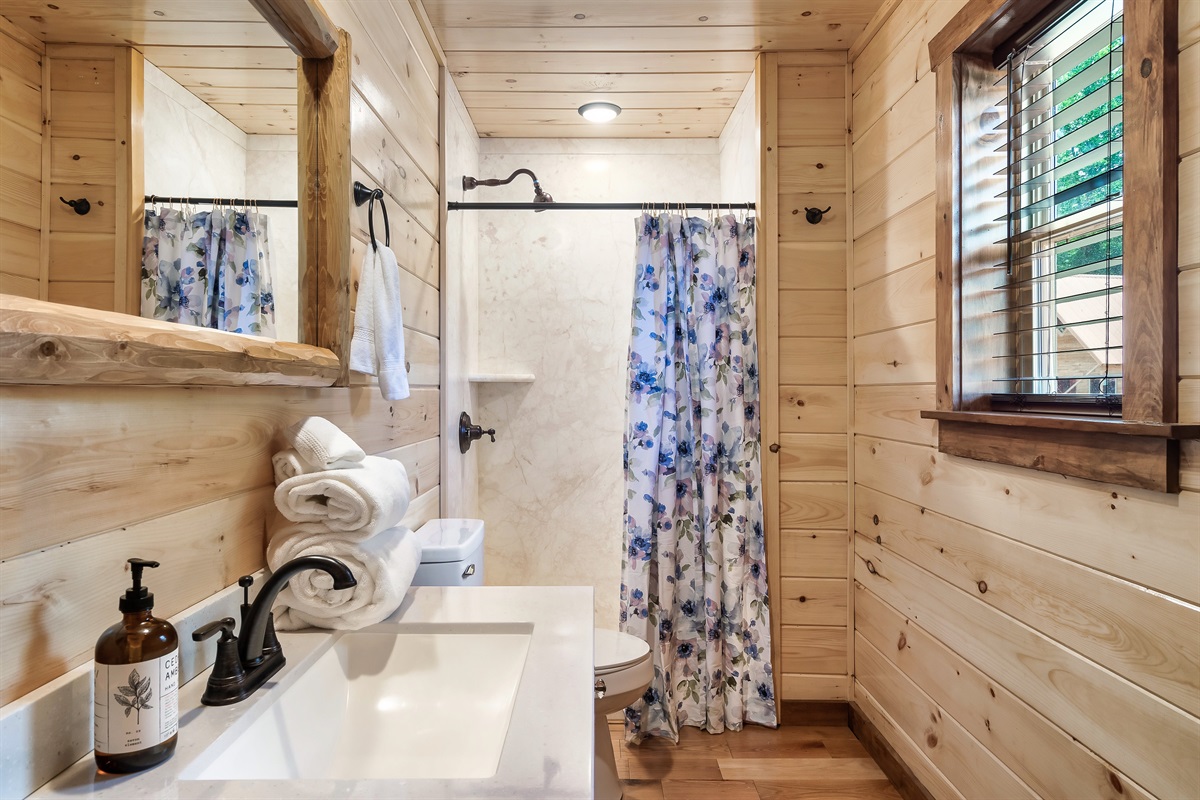 The "Bless Your Heart" bathroom has a walk in shower